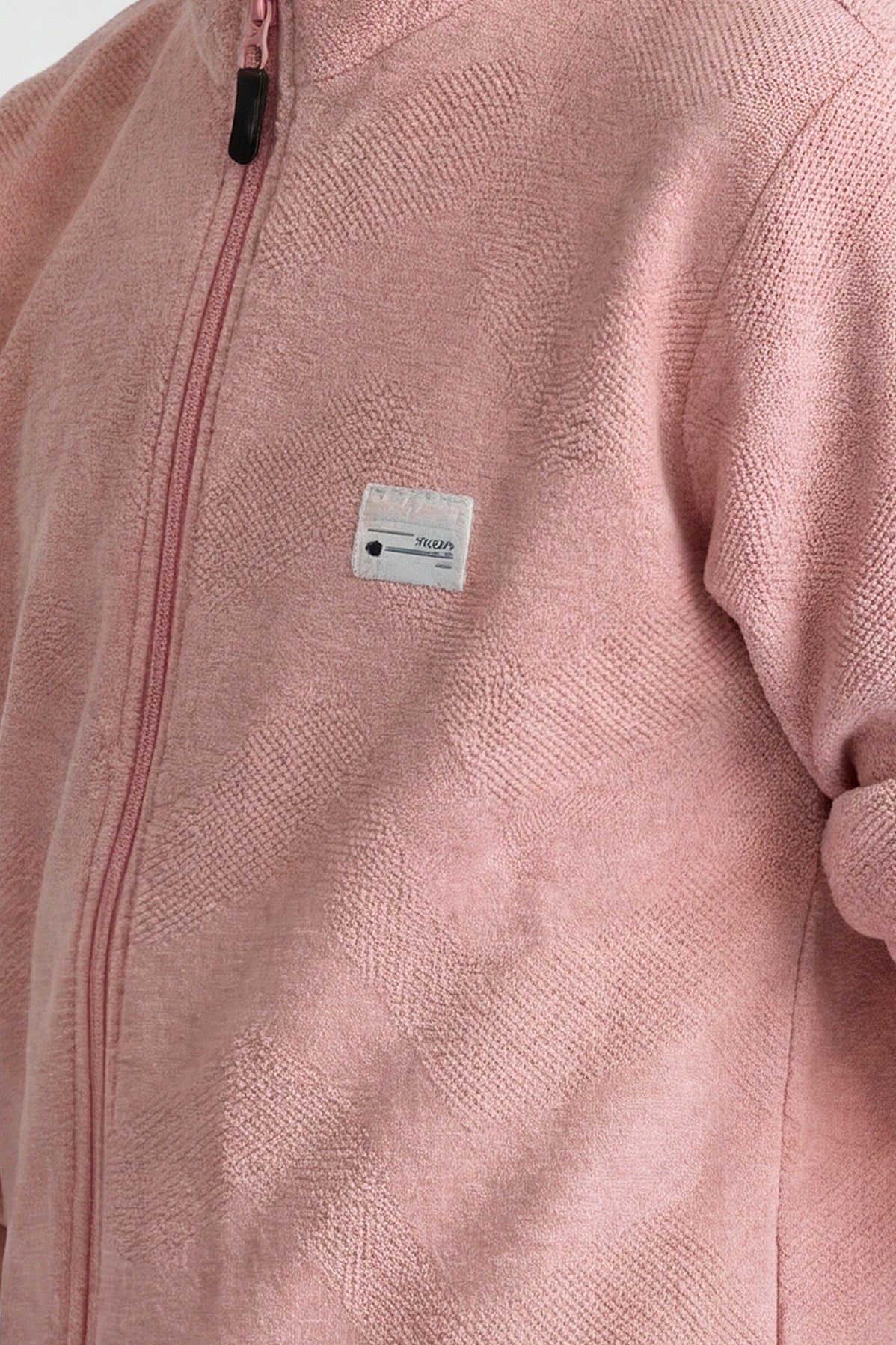 Boys' jacket with a full zip front and stand collar.